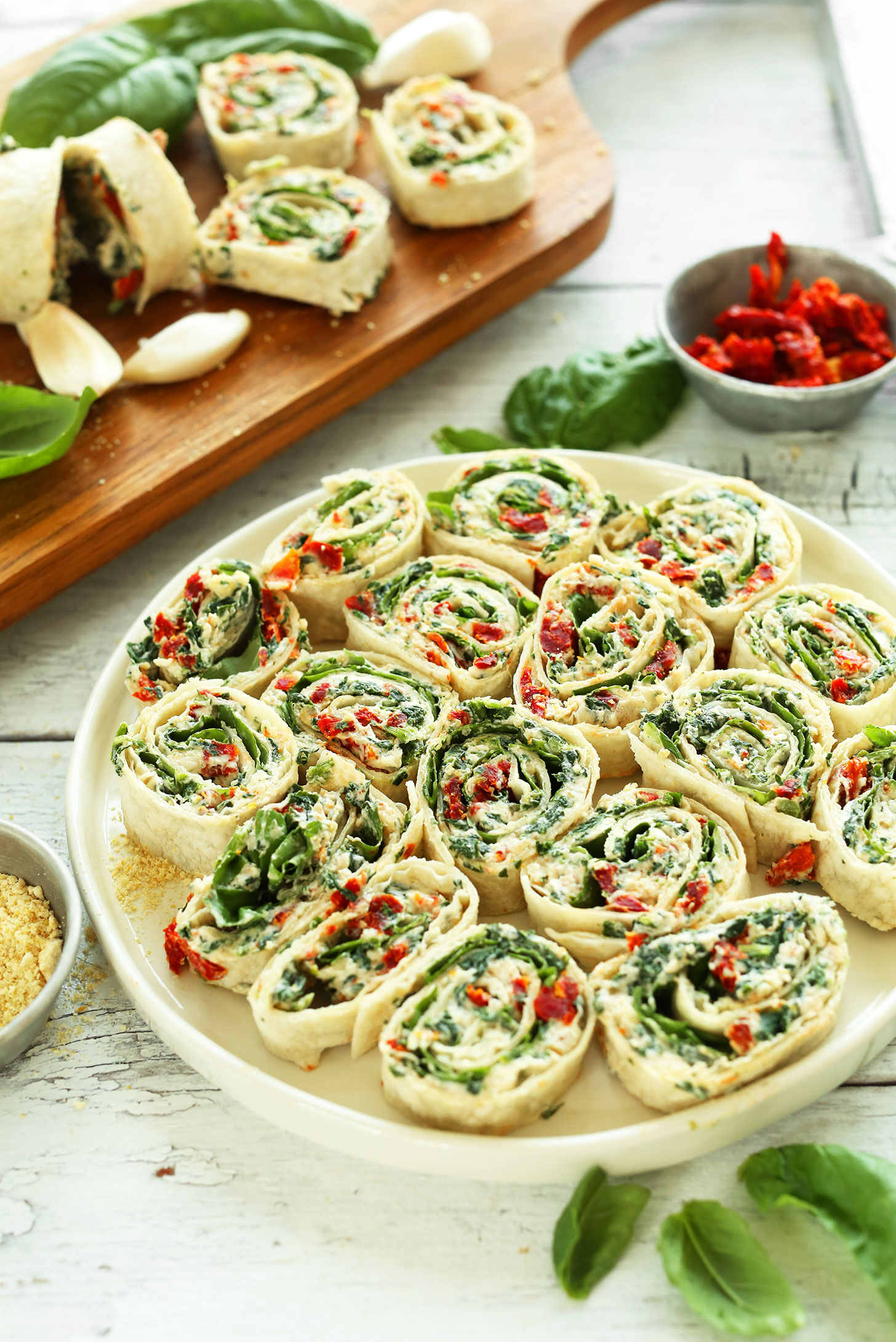 Plate of delicious vegan Sun-Dried Tomato and Basil Pinwheels for a healthy snack
