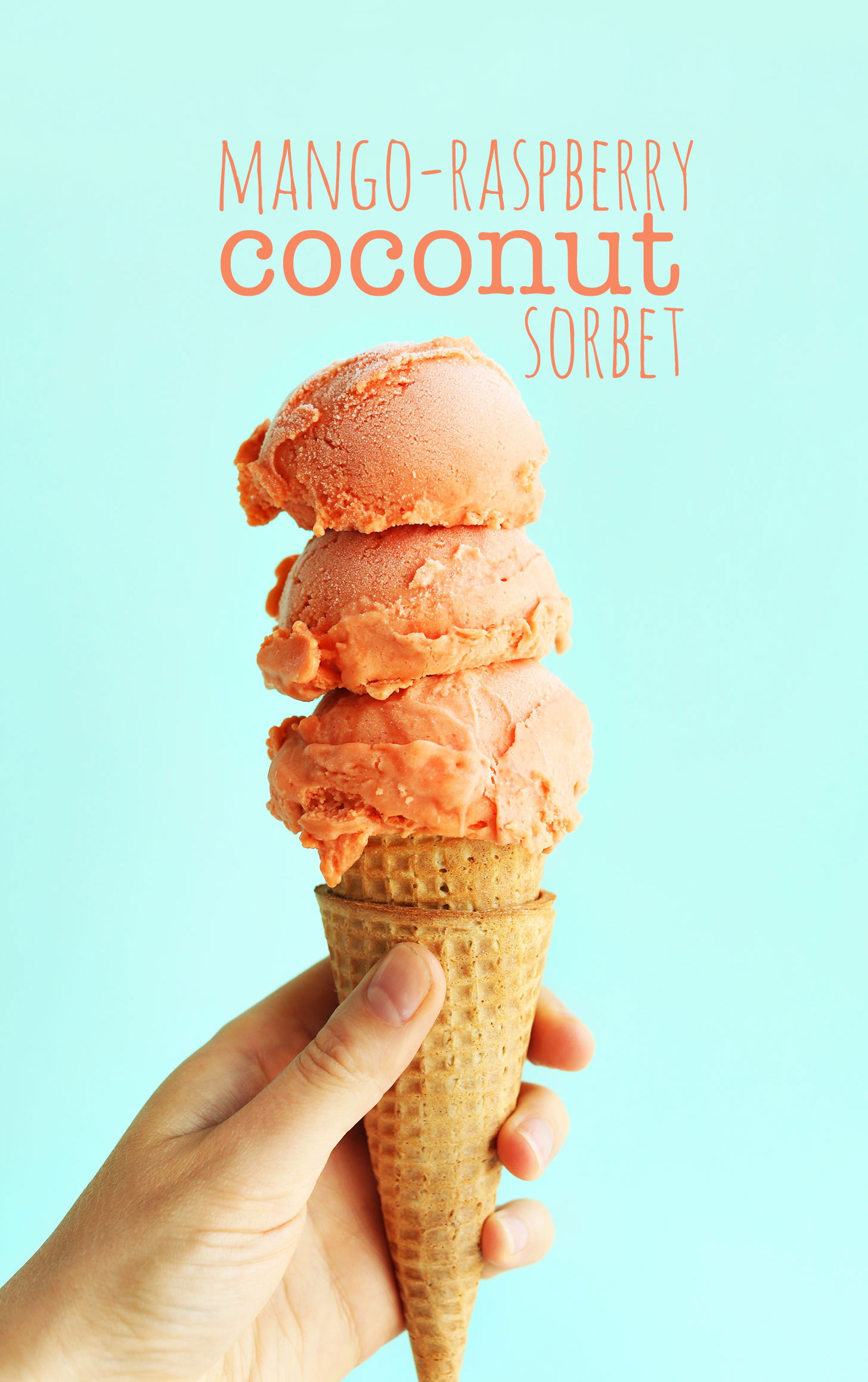 Sugar cone with triple scoop of vegan Raspberry Coconut Sorbet