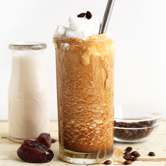 Tall overflowing glass of our Caramel Frappuccino recipe
