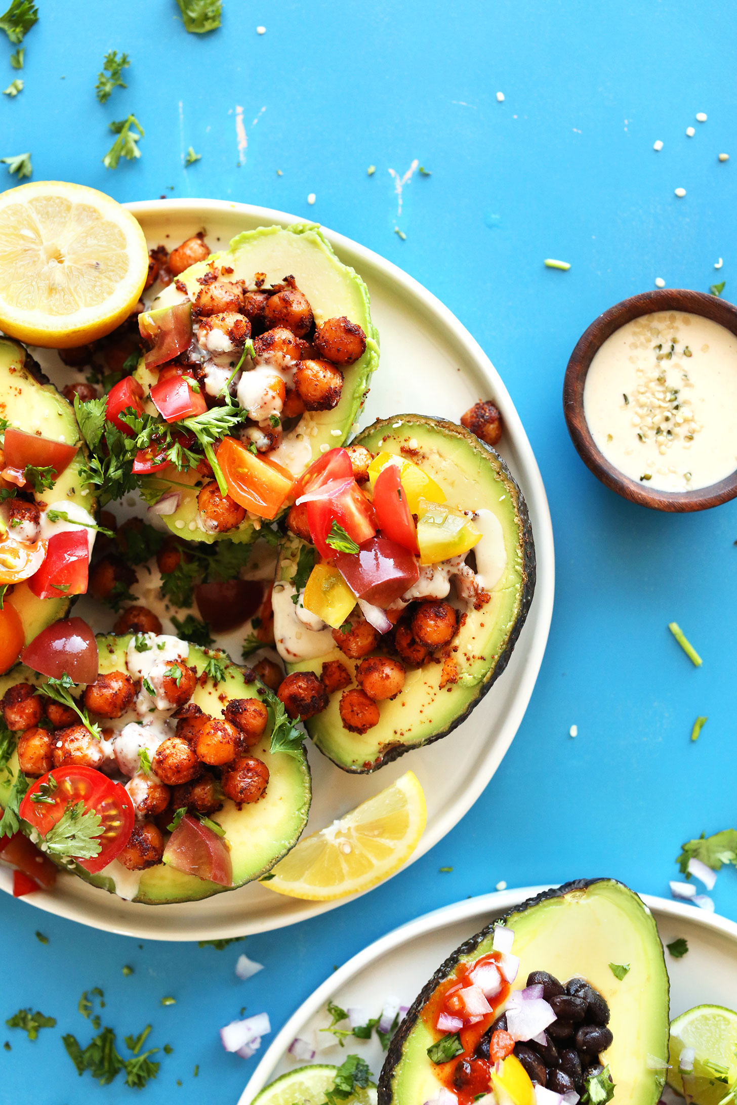 Plates of our Mediterranean- and Mexican-inspired avocado boat recipes