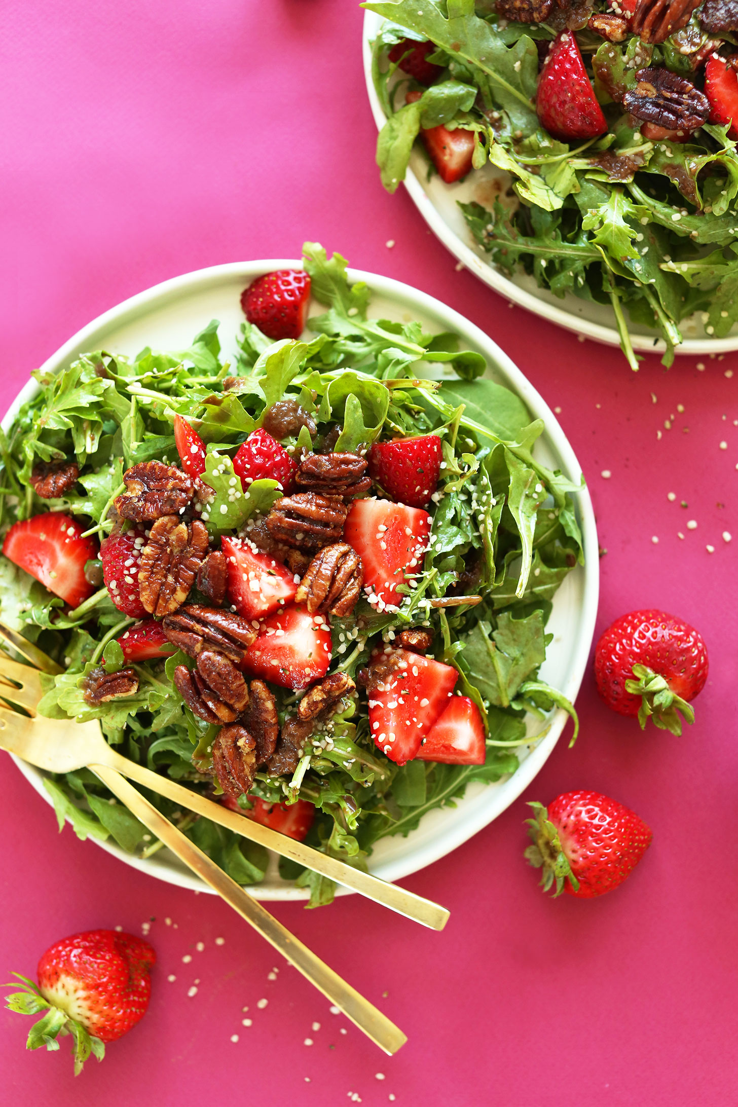 Big plate filled with Strawberry Arugula Salad with Brown Sugar Pecans and a Warm Shallot Vinaigrette