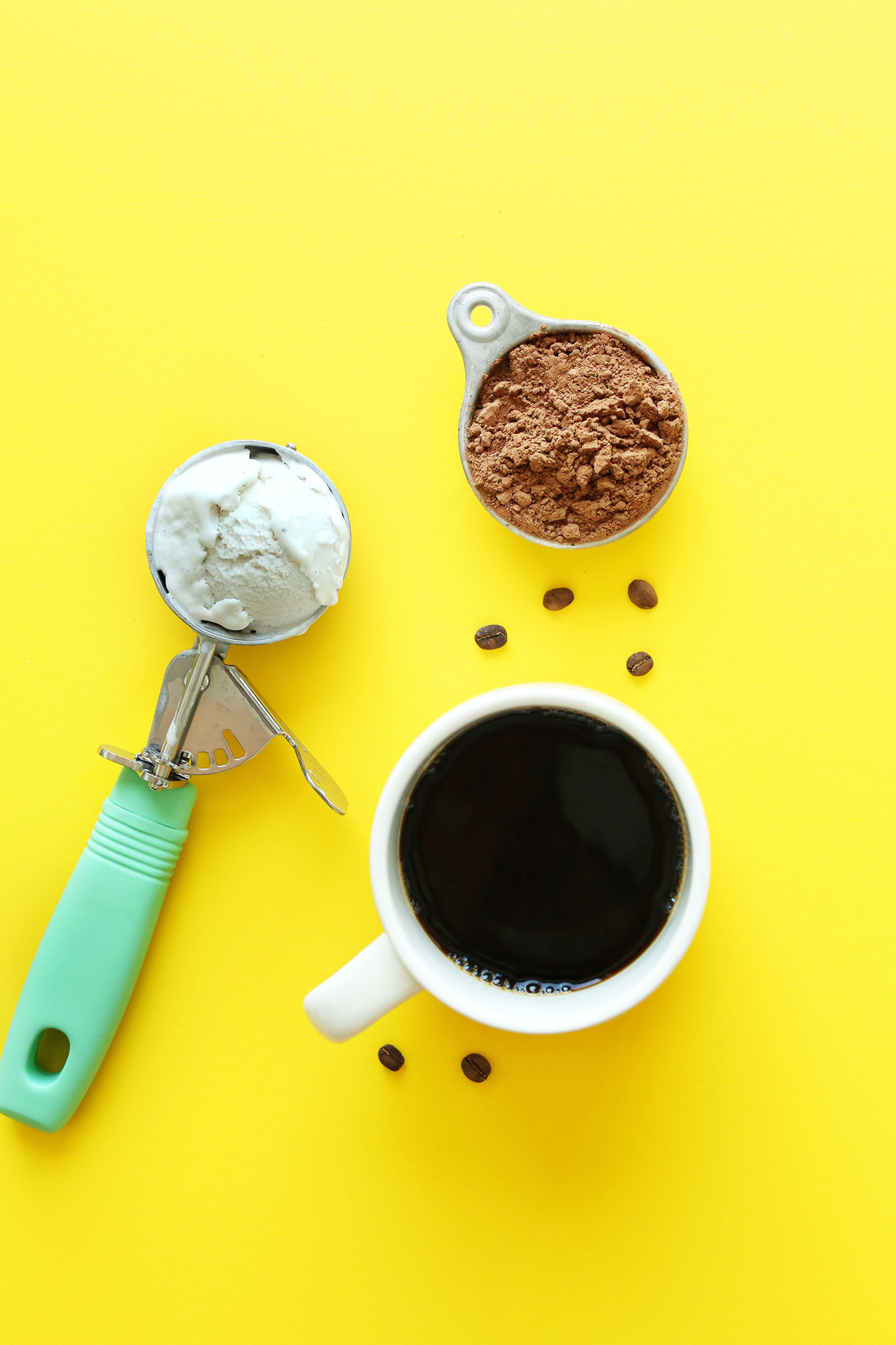Cocoa powder, vegan ice cream, and coffee for making a delicious vegan milkshake