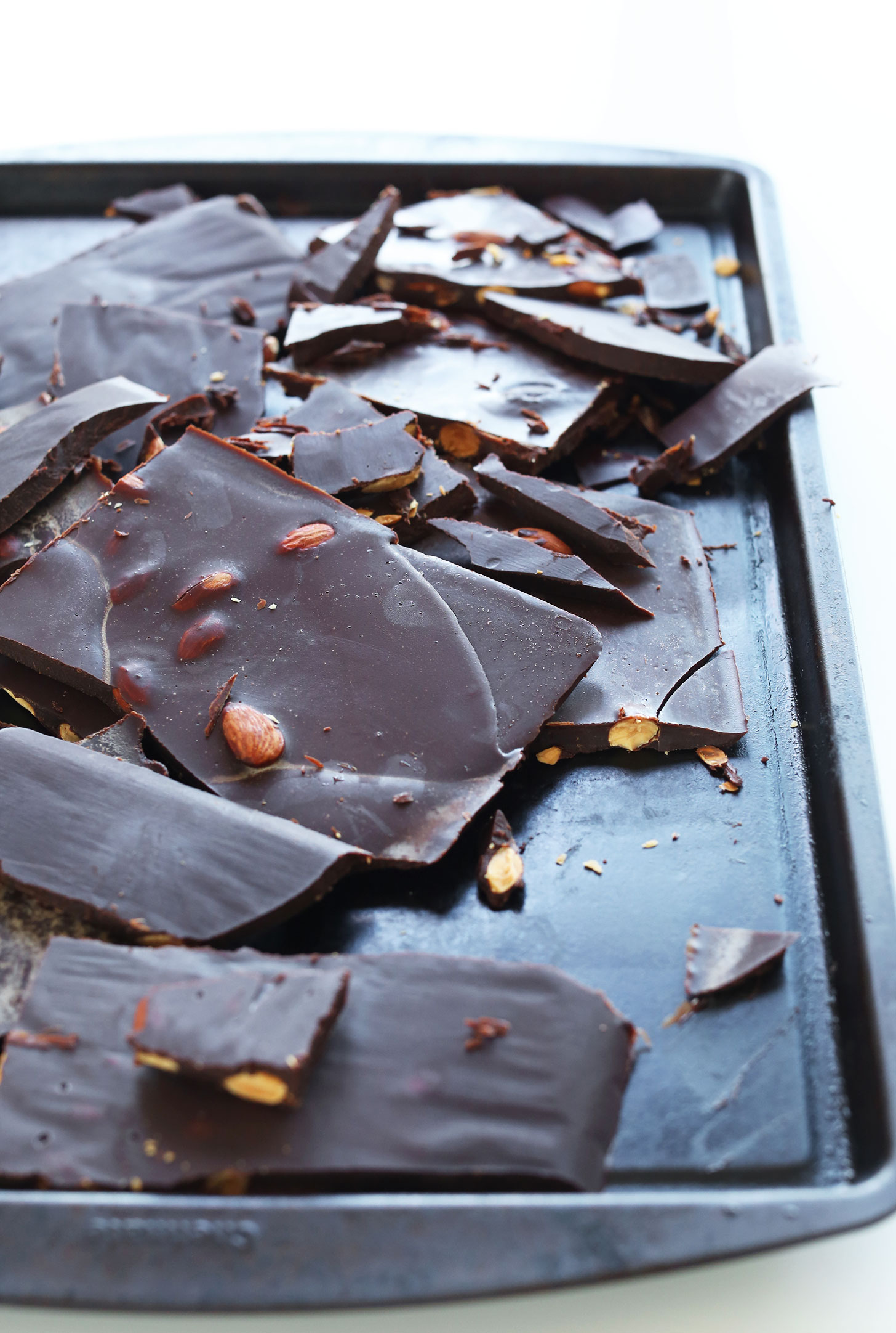 Baking sheet with DIY Dark Chocolate Bars with Almonds