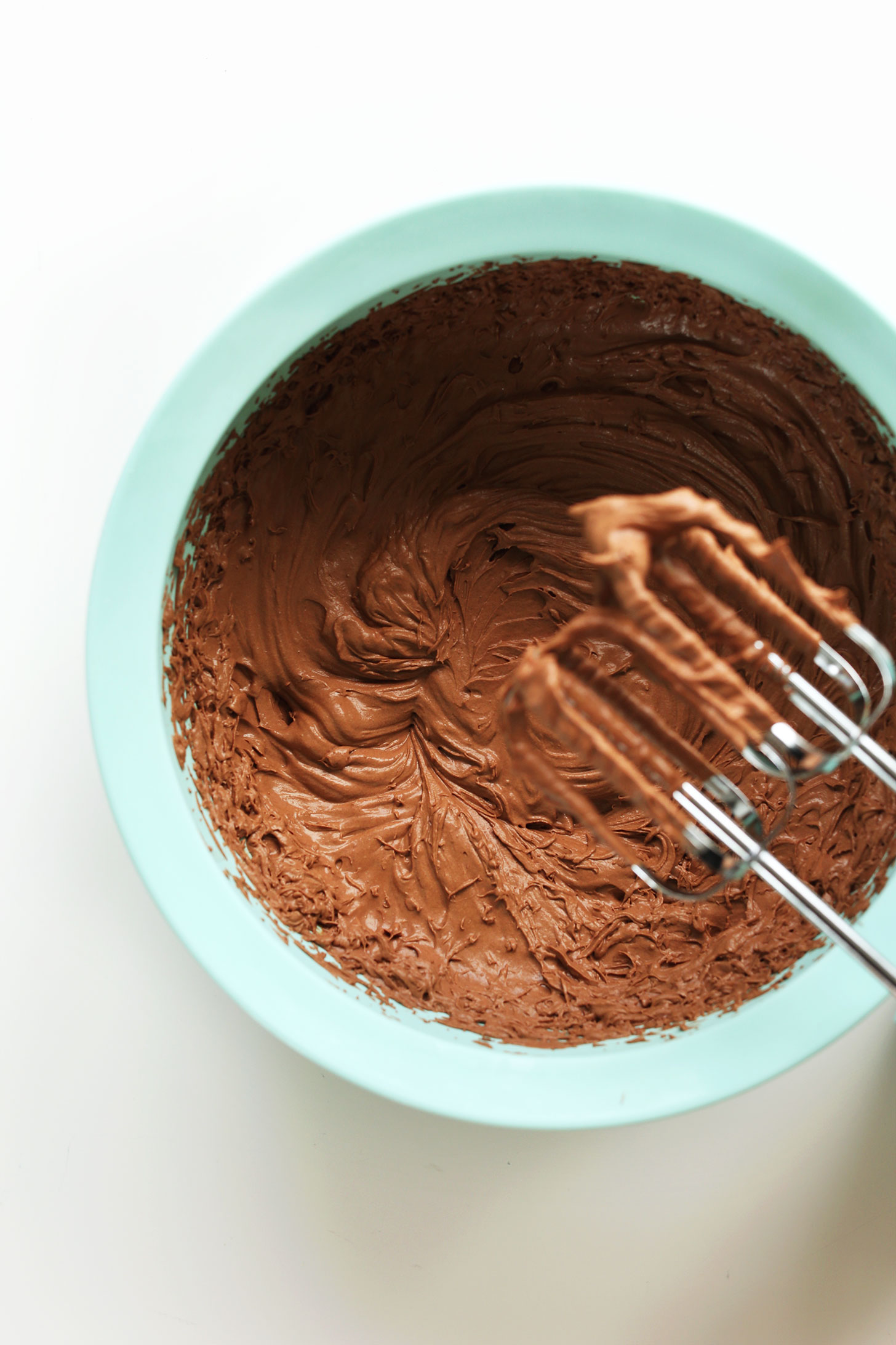 Using a hand mixer to whip the filling of our Pretzel Peanut Butter Chocolate Pie recipe
