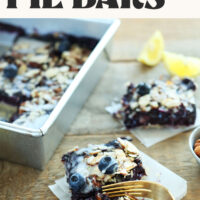 Almond Lemon Blueberry Pie Bars in a baking pan and next to it