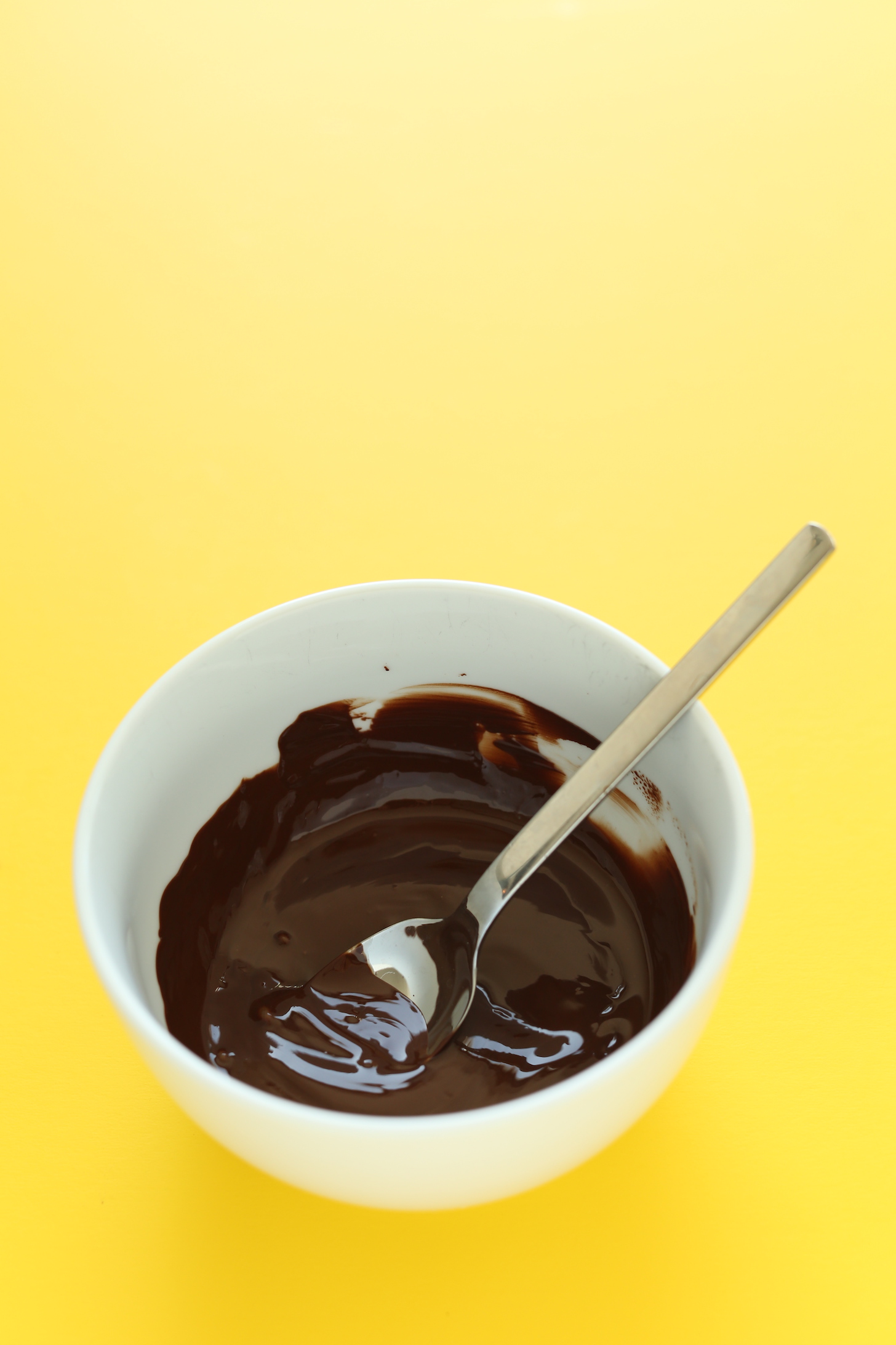 Bowl of melted dark chocolate for making a Vegan Magic Shell
