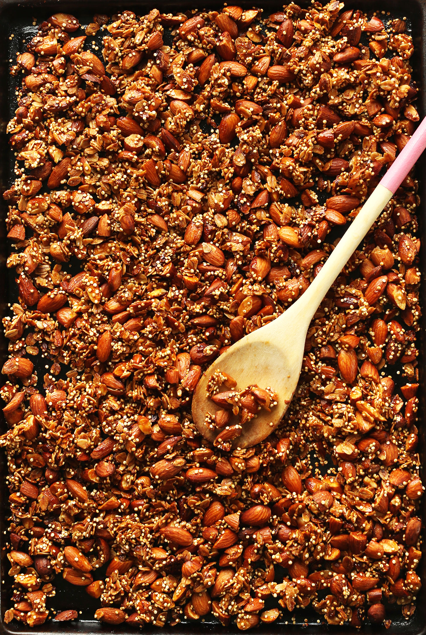 Baking sheet filled with naturally-sweetened gluten-free vegan Quinoa Granola