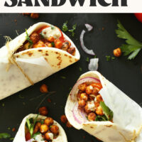 Three Chickpea Shawarma Sandwiches wrapped with parchment paper and twine with text above them saying 30-minute meal