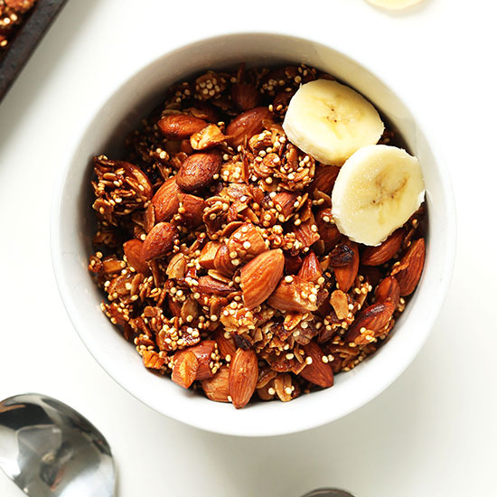 Bowl of Quinoa Granola with two slices of banana