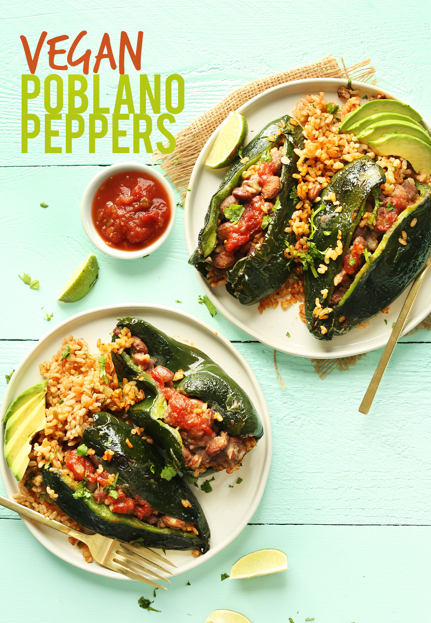 Plates of Vegan Stuffed Poblano Peppers with garnishes of lime, avocado, and salsa