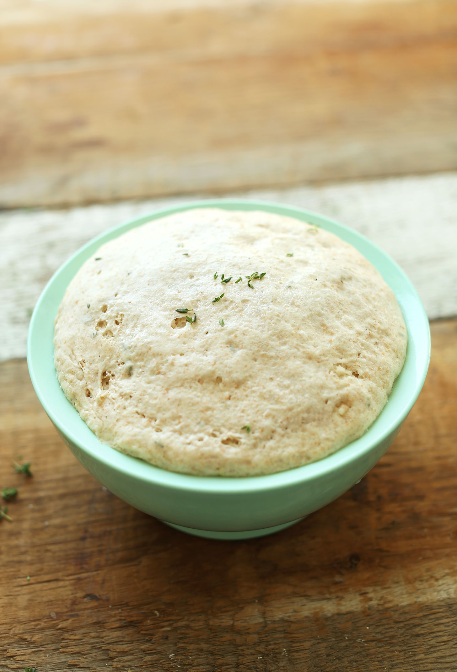 Bowl of freshly risen dough for making vegan spelt flatbread