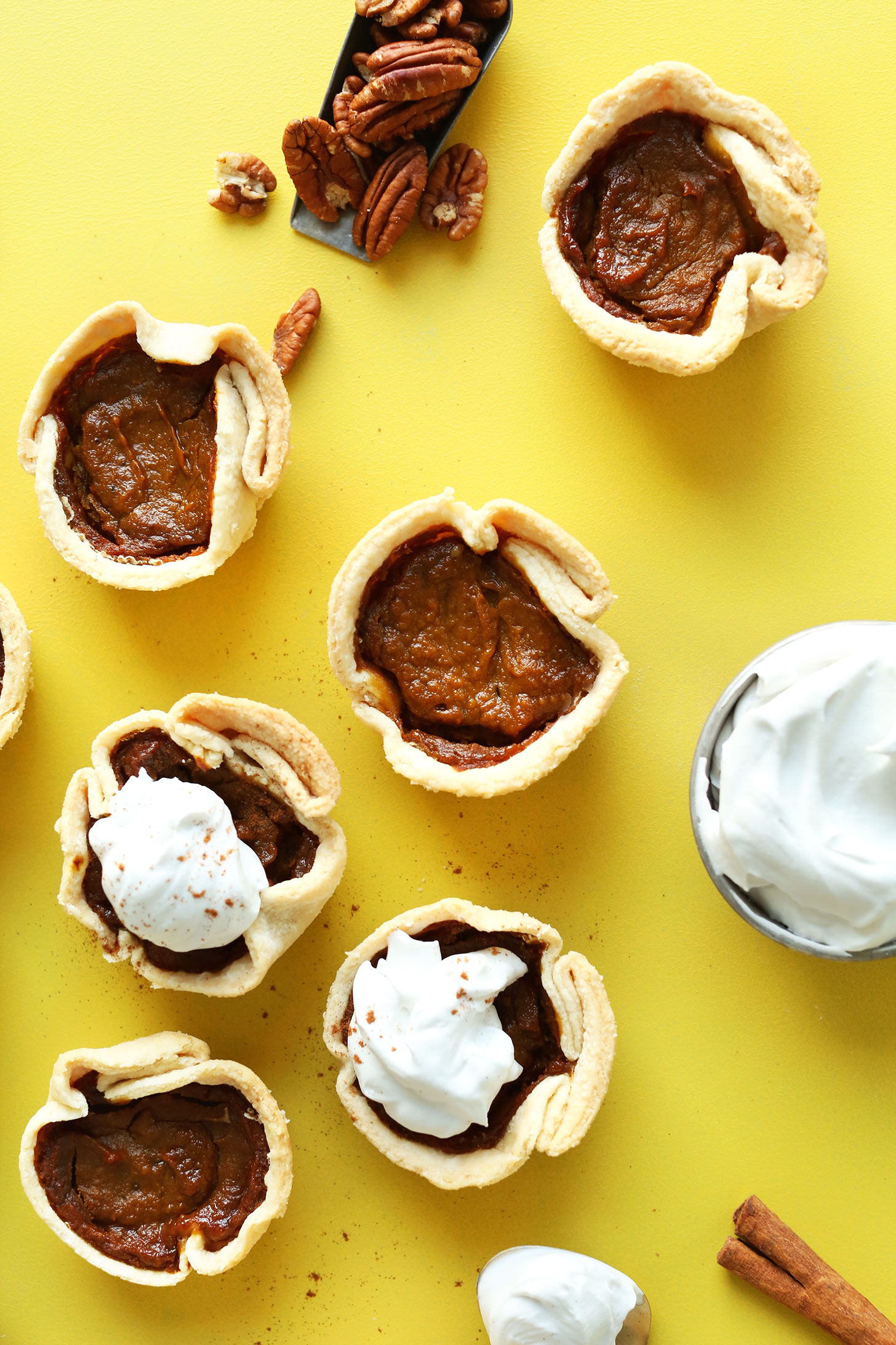 Mini Vegan Pumpkin Pies topped with coconut whipped cream