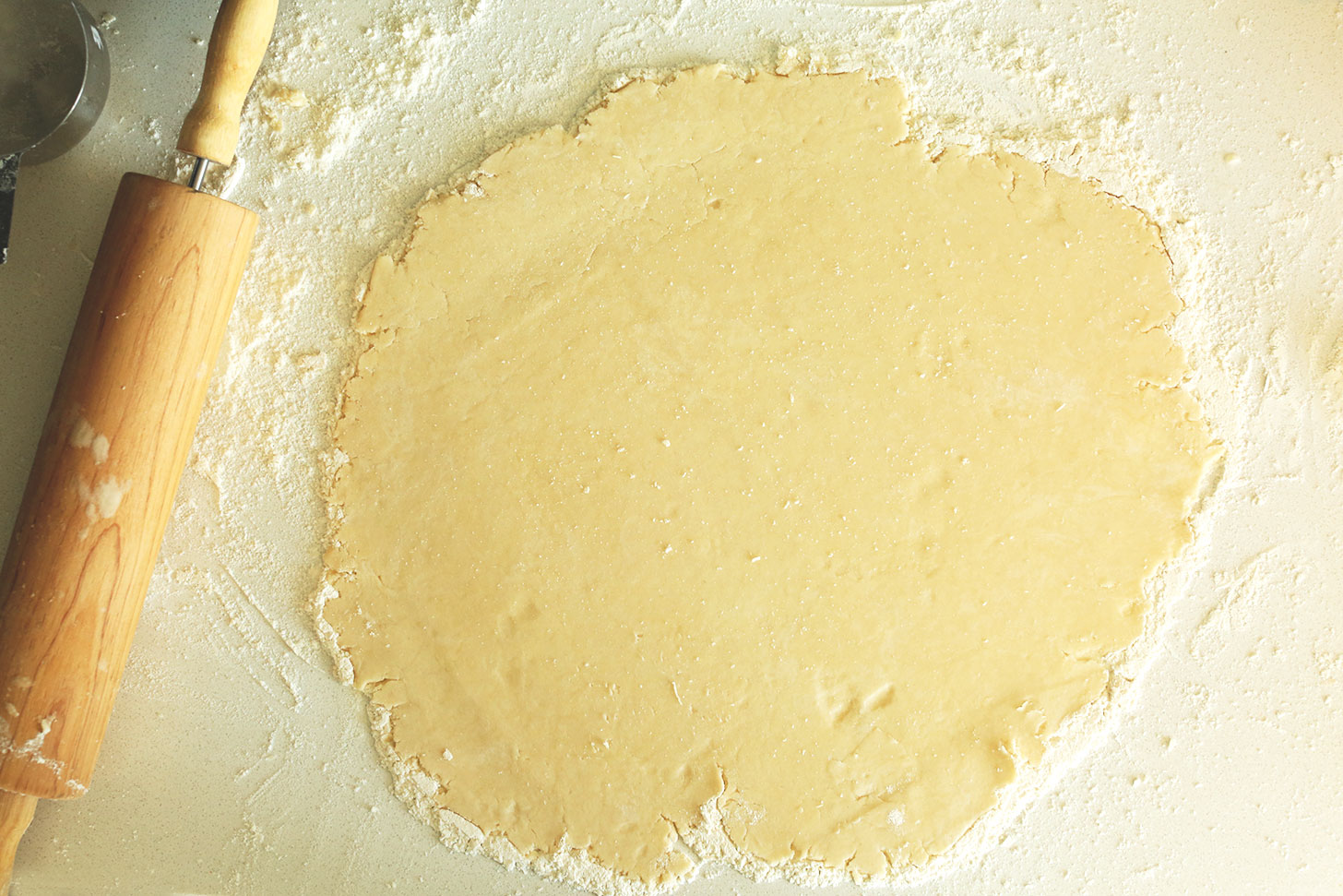 Rolling pin beside a freshly rolled out Coconut Oil Pie Crust