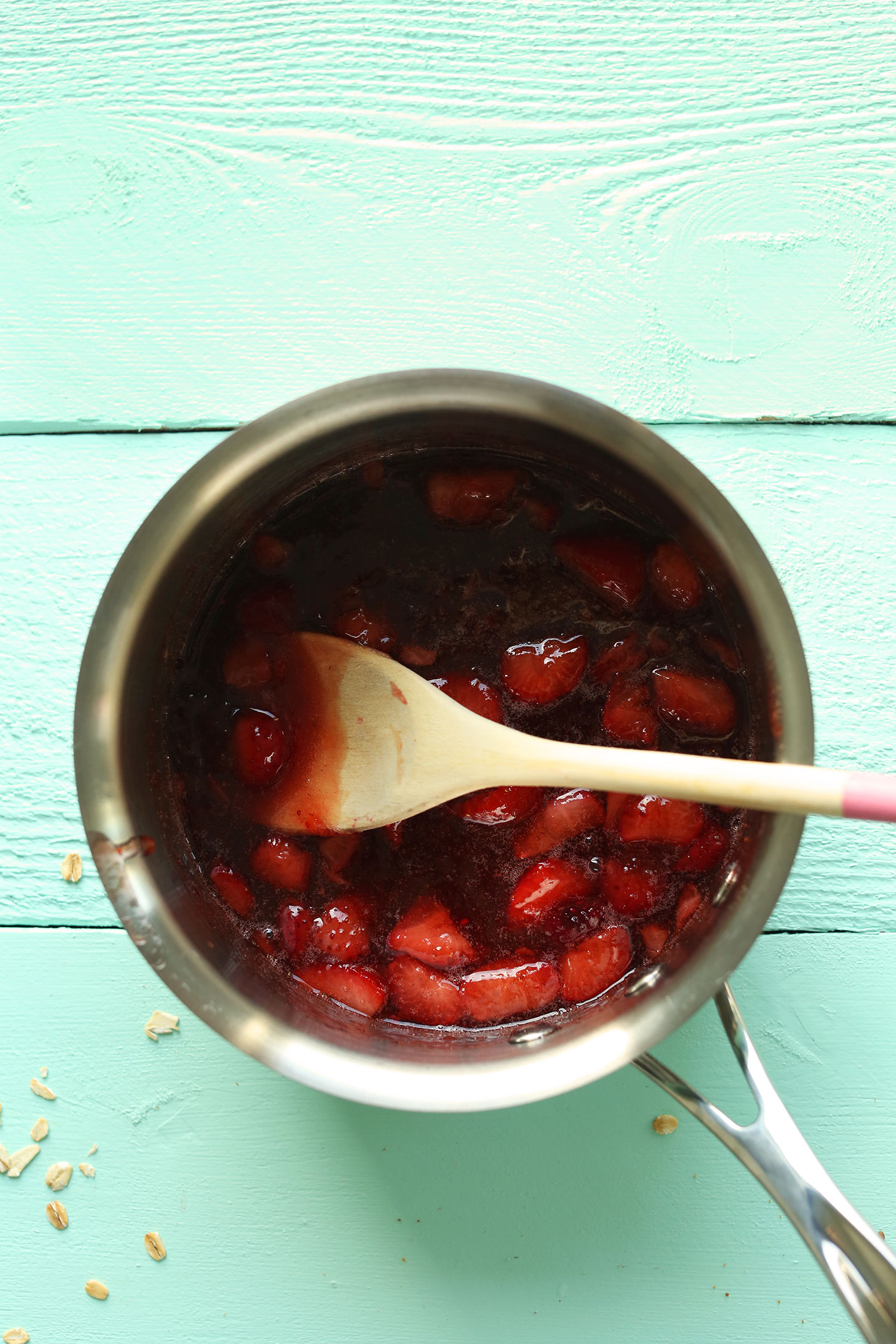 Cooking strawberries and jam in a saucepan