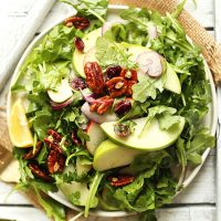 Big plate of Apple Pecan Arugula Salad for a healthy vegan side dish