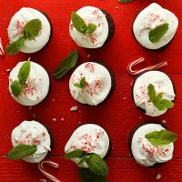 Nine Chocolate Peppermint Cupcakes on a red wood background
