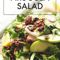 Plate of vegan and gluten-free apple pecan arugula salad