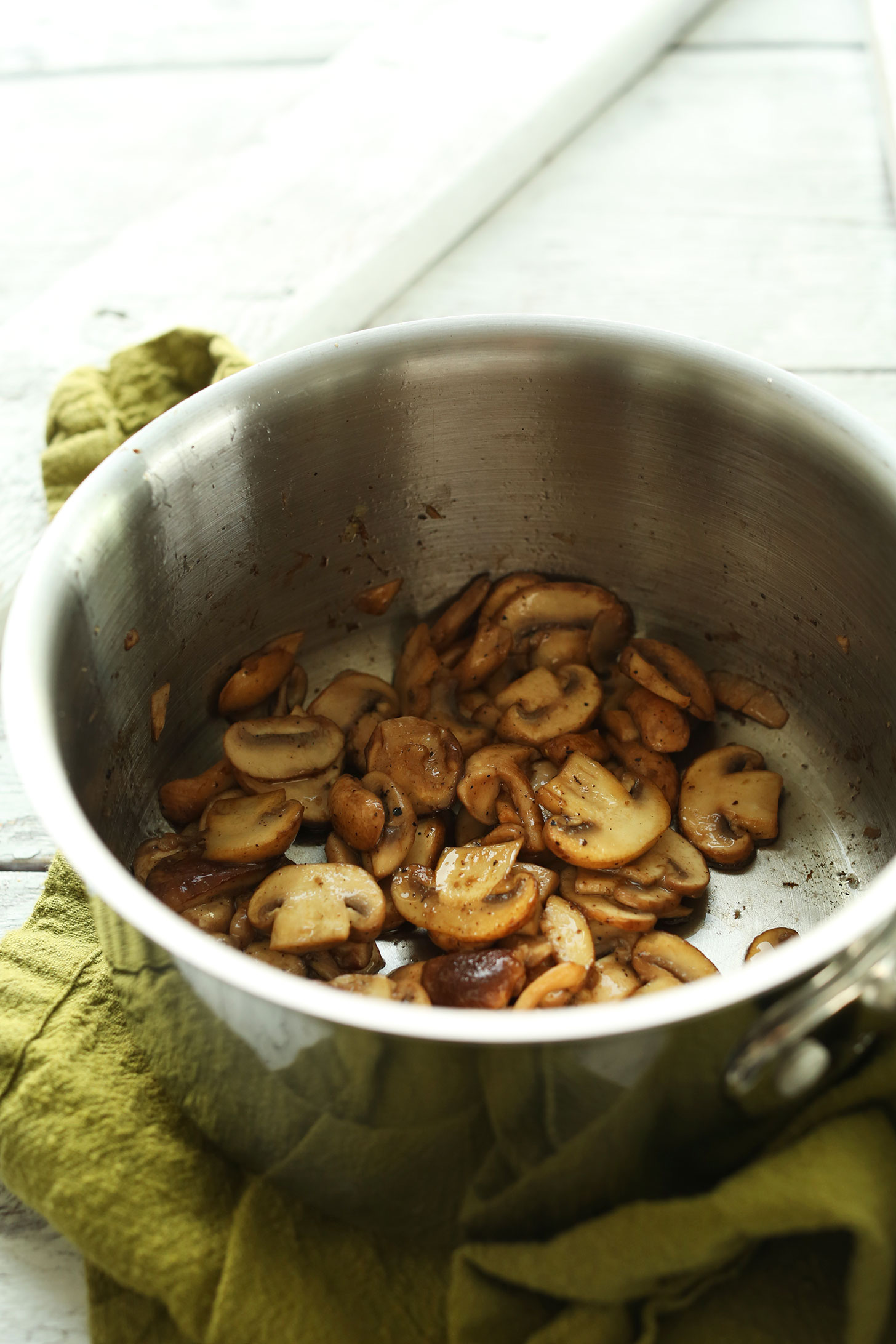 Sautéing mushrooms to make Easy Vegan Risotto with Mushrooms and Leeks