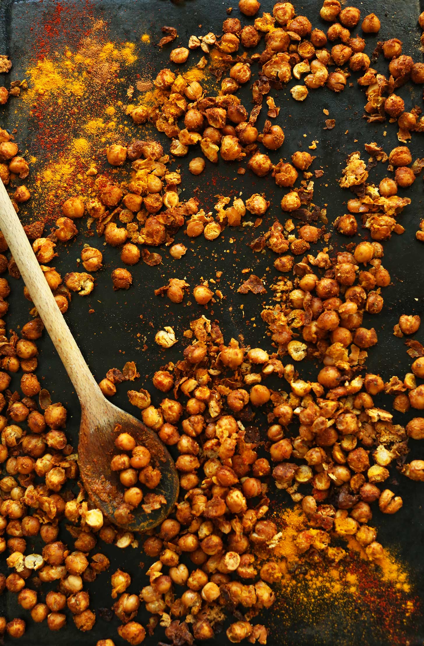 Baking sheet with Shawarma-spiced chickpeas for adding protein to a plant-based salad