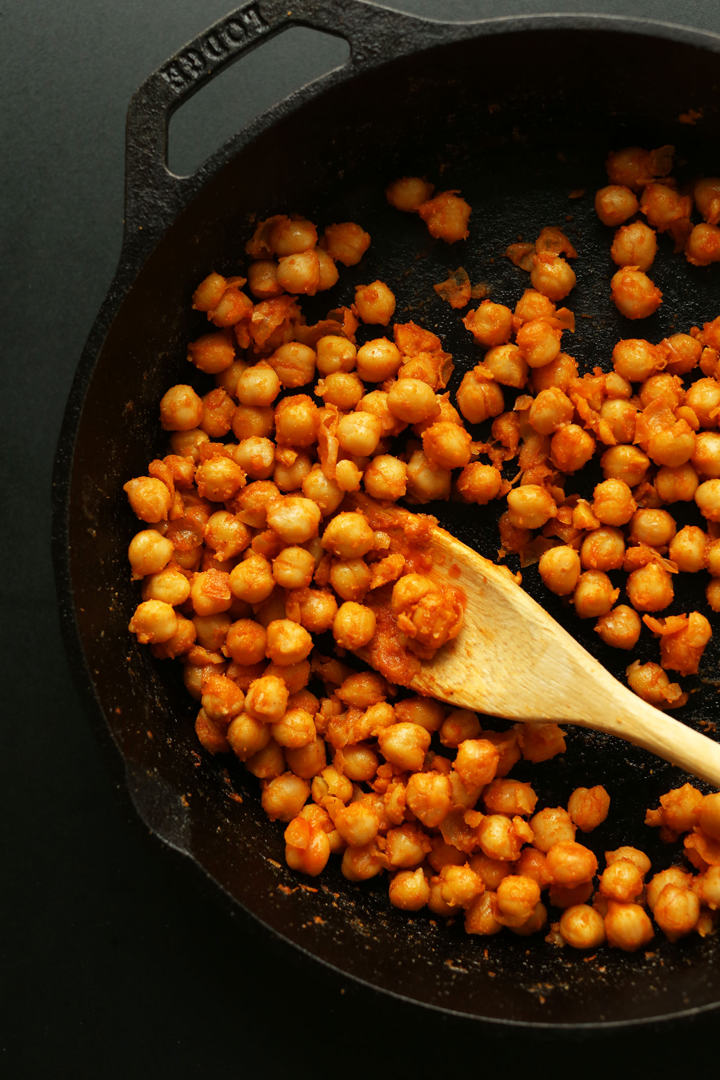 Cooking Buffalo Chickpeas in a cast-iron skillet