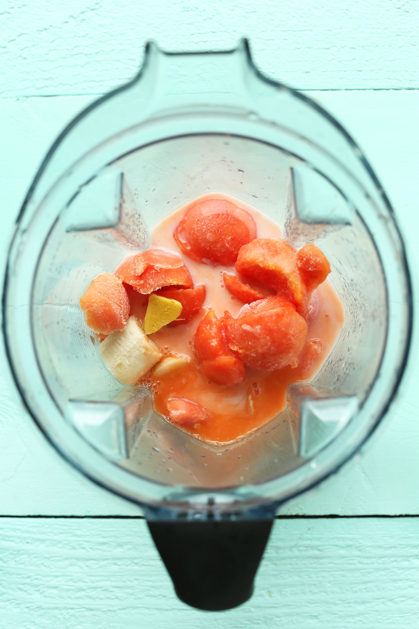 Blender with ingredients for making our refreshing Papaya Smoothie recipe