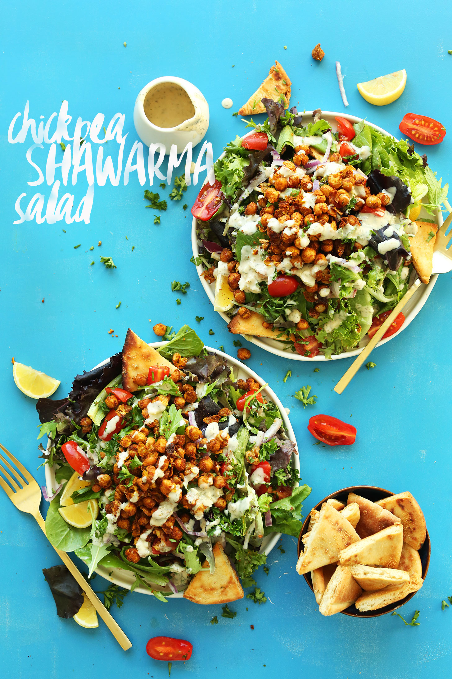 Two big dinner plates filled with our quick and delicious Chickpea Shawarma Salad recipe