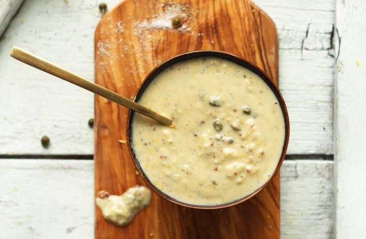 Bowl of our simple vegan caesar dressing recipe made with capers, lemon, and dijon