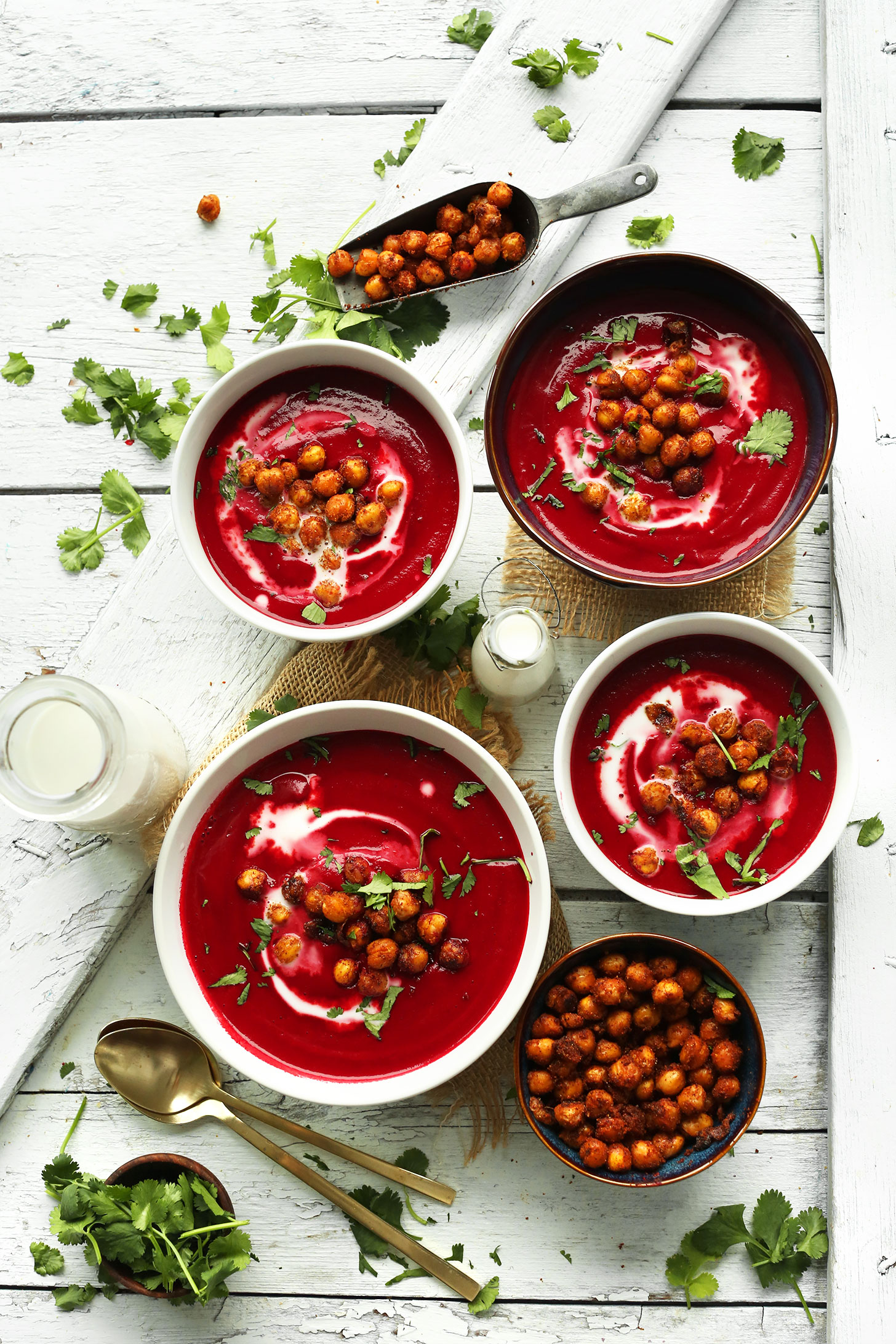 Bowls of our vegan Curried Beet Soup topped with Crispy Tandoori Chickpeas and cilantro