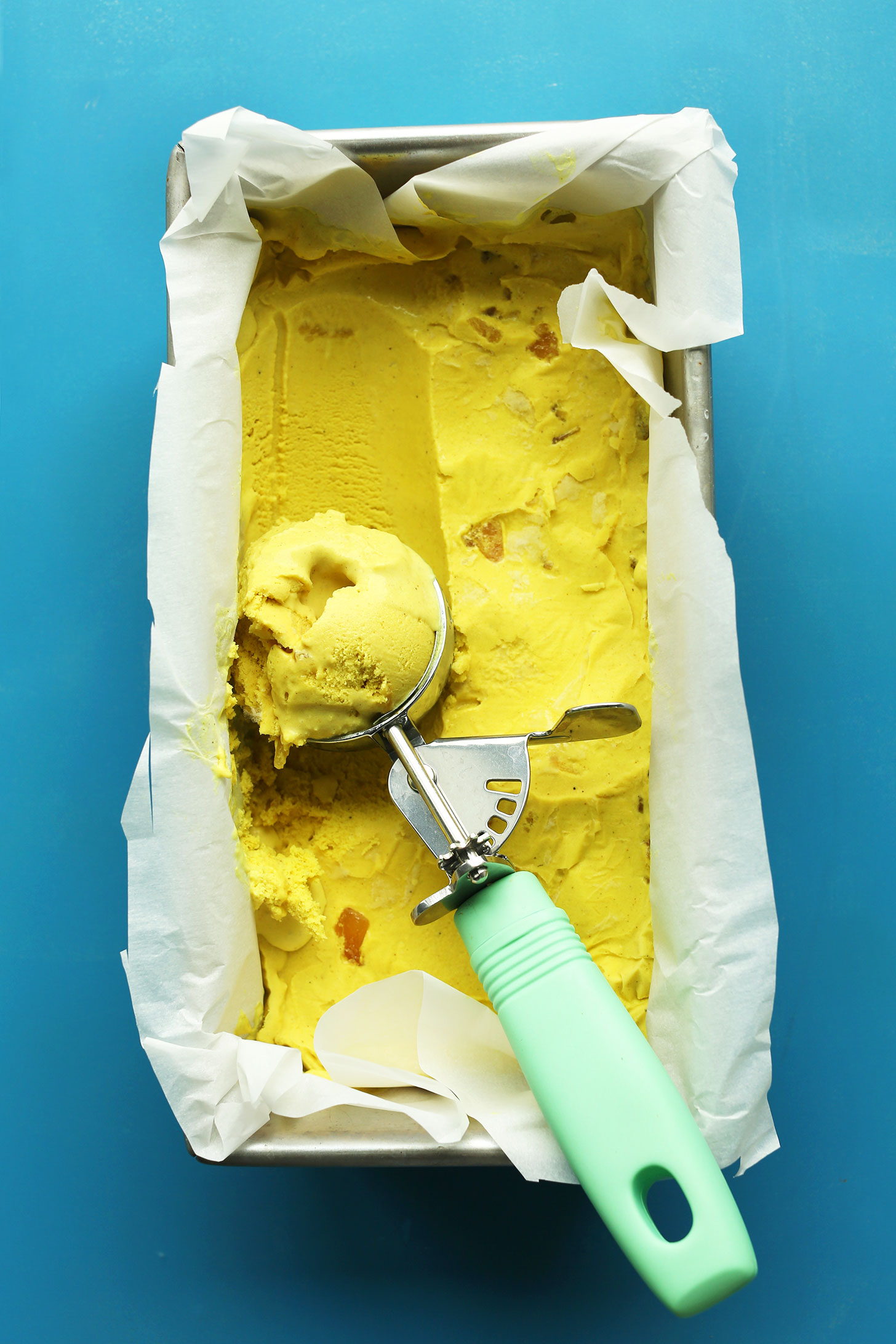 Scooping out gluten-free vegan ice cream made with golden milk
