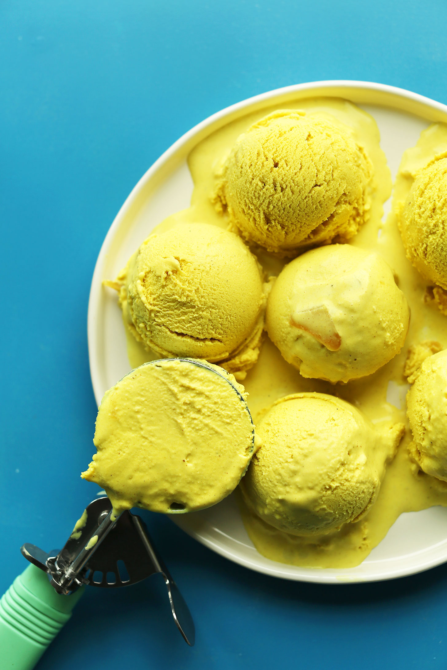 Plate with scoops of our delicious creamy vegan Golden Milk Ice Cream