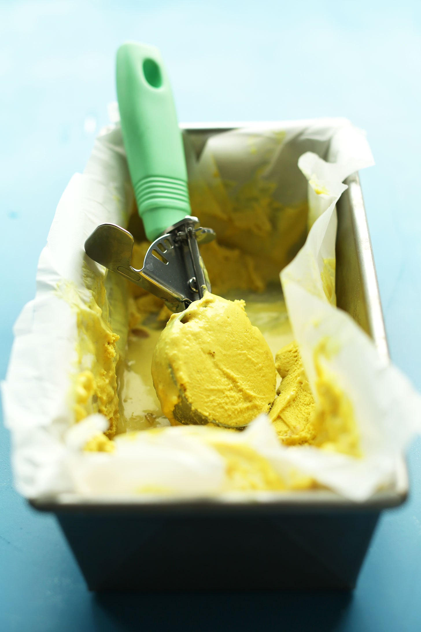 Grabbing a scoop of healthy vegan ice cream made with turmeric