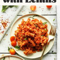 Two plates of our vegan gluten-free spicy red pasta with lentils