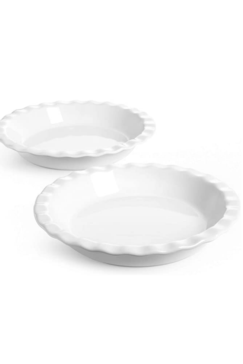 A set of two white ceramic pie pans