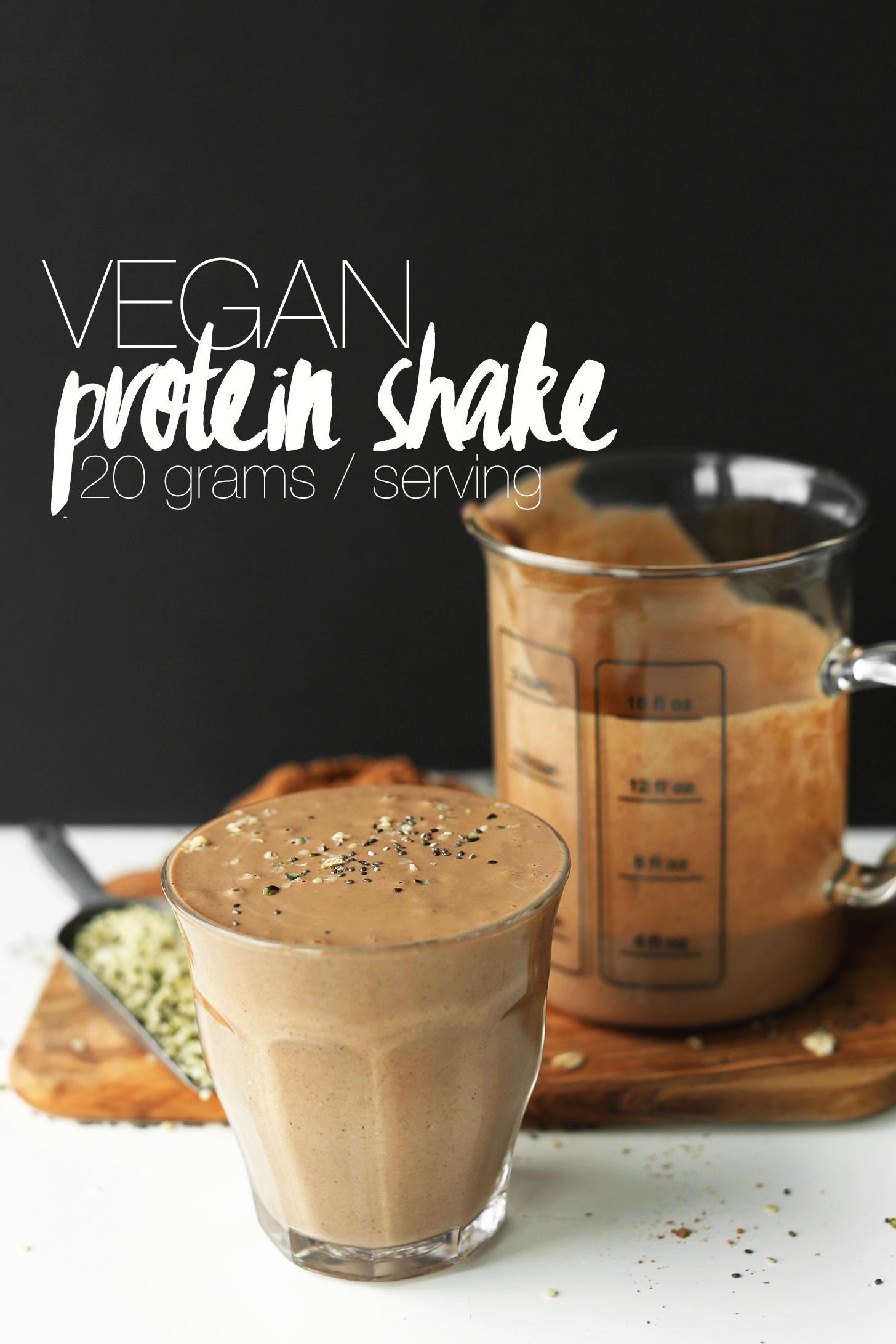 Measuring jar and glass filled with our Vegan Protein Shake recipe