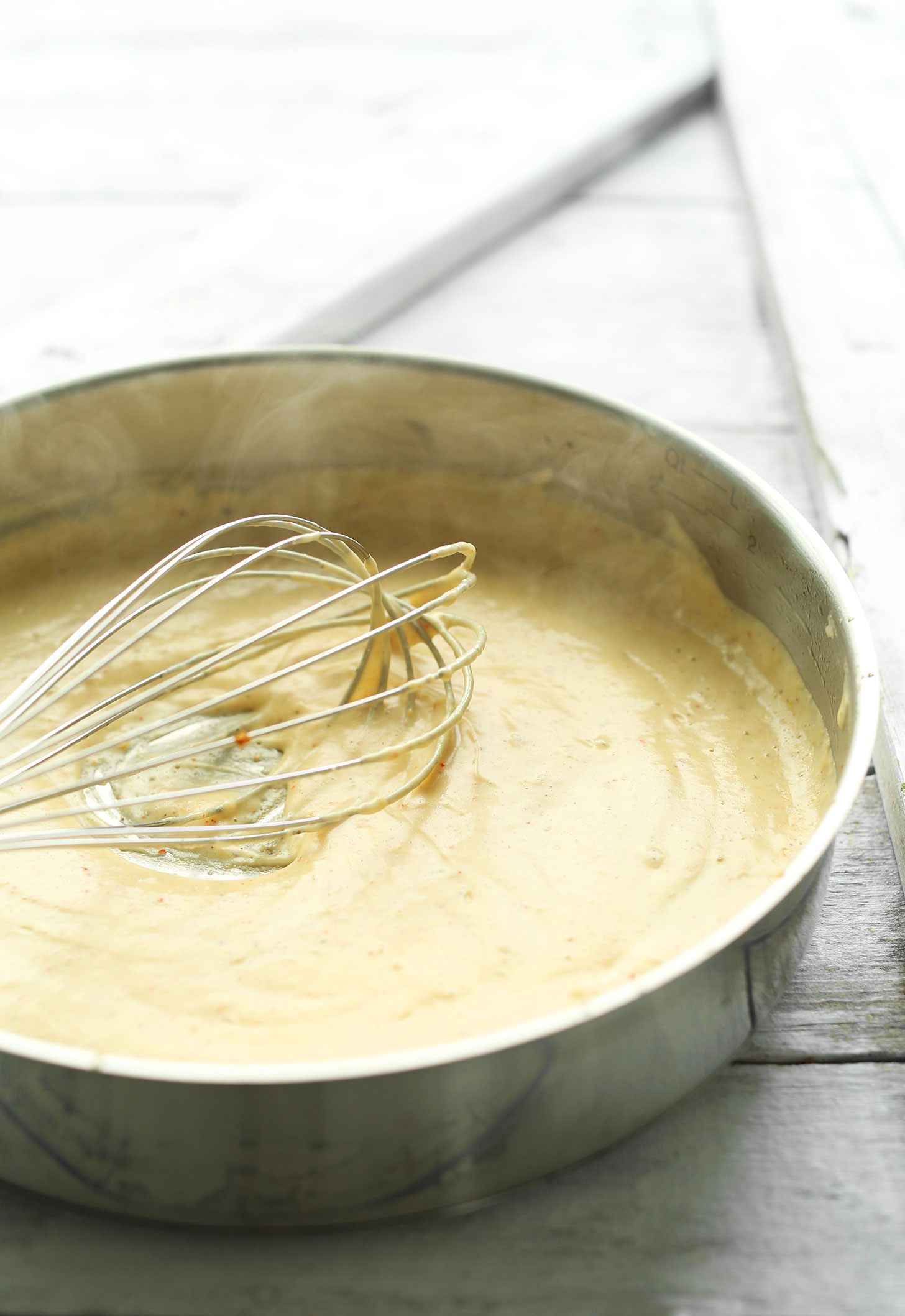 Whisking ingredients for the vegan sauce for Creamy Asparagus & Mushroom Pasta