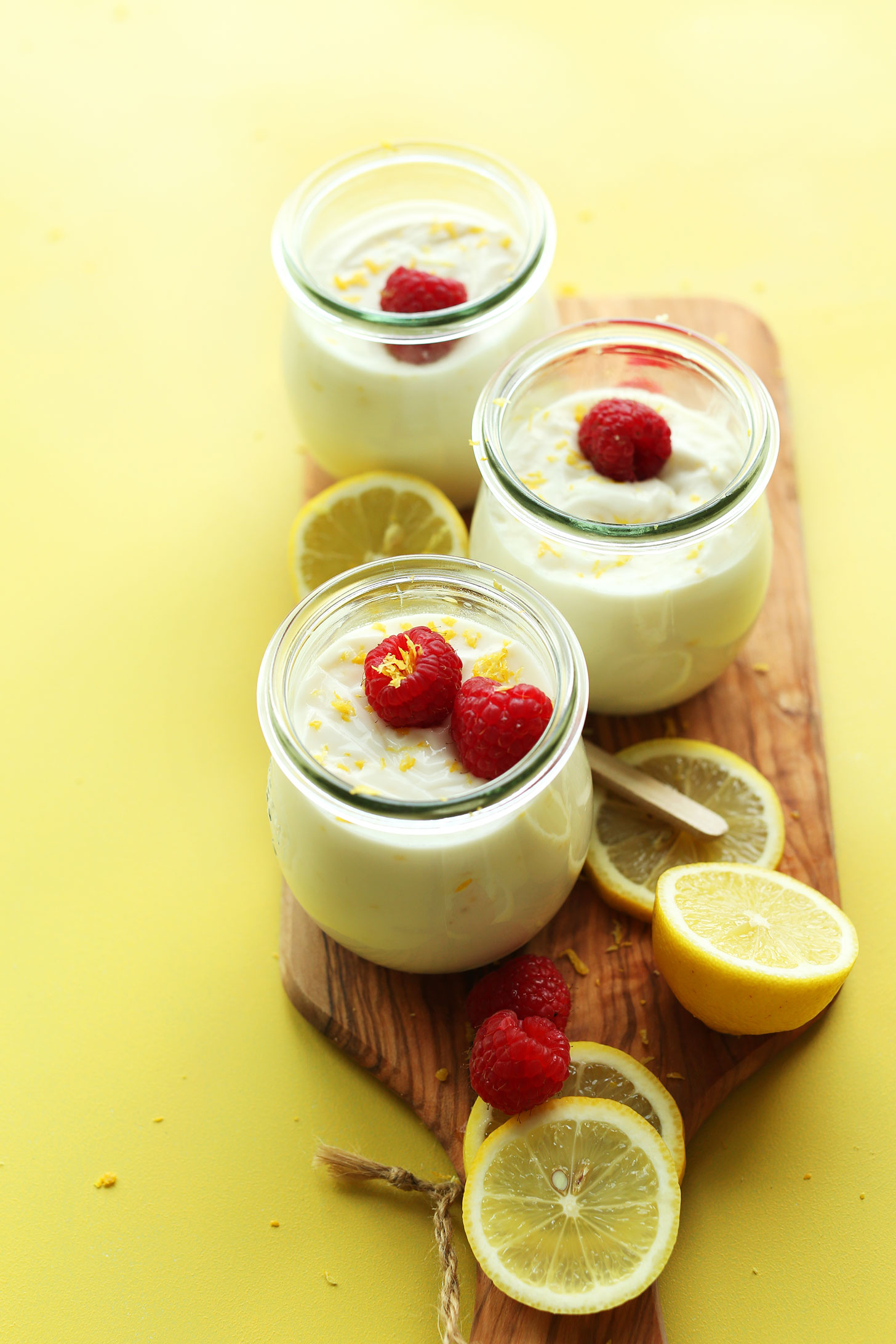 Top view of three jars of creamy vegan lemon curd for a delicious refreshing dessert