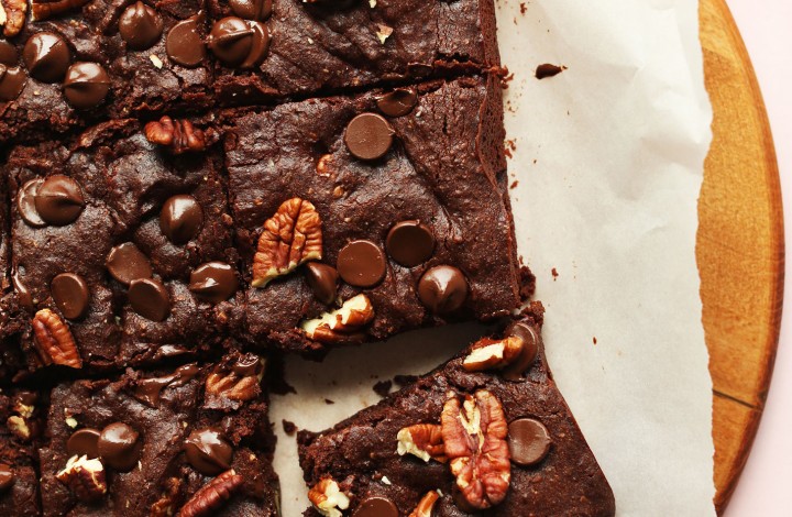 Stack of perfectly cut gluten-free vegan Brownies with pecans and dark chocolate chips