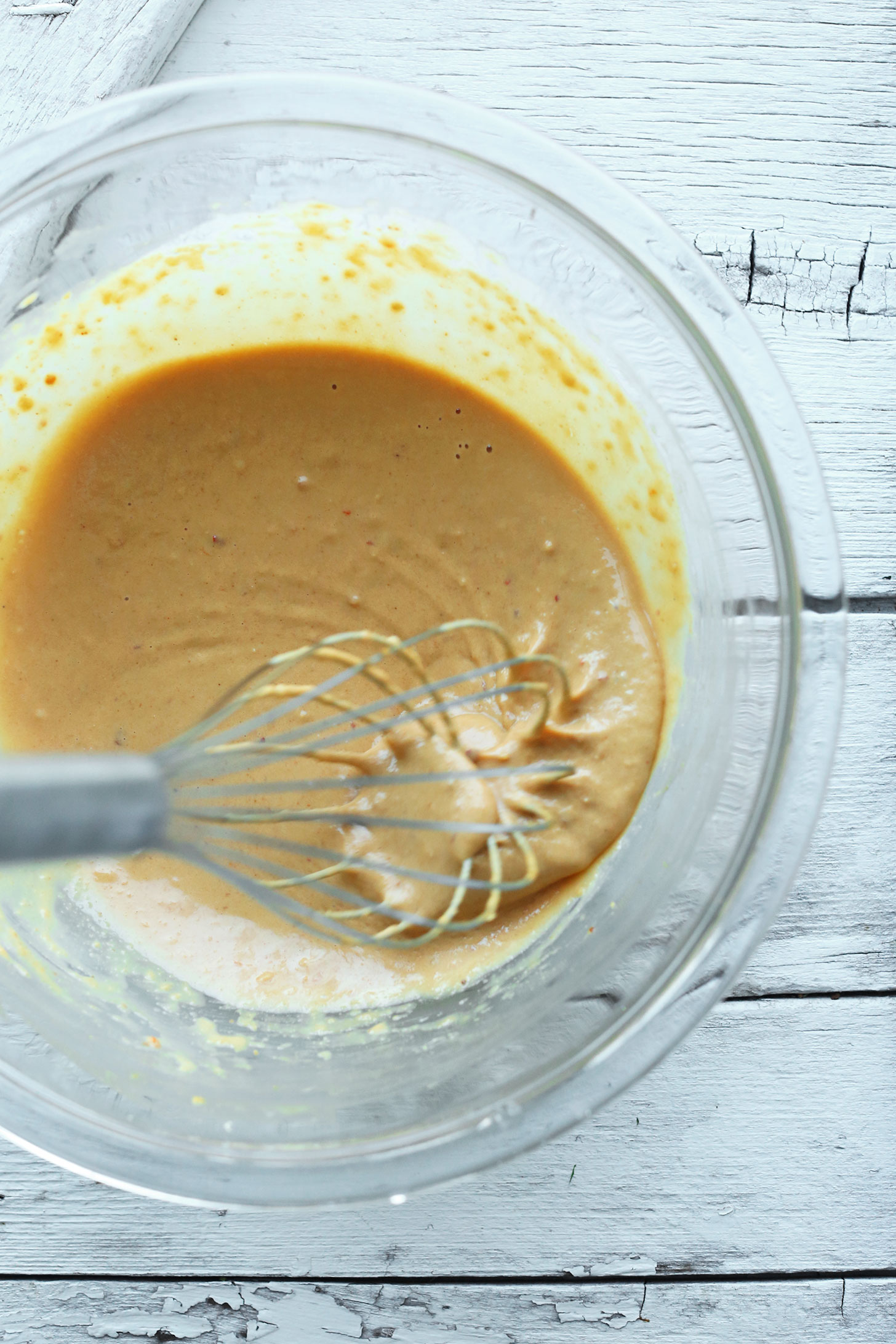 Whisking together Cashew Dressing for a healthy gluten-free vegan salad