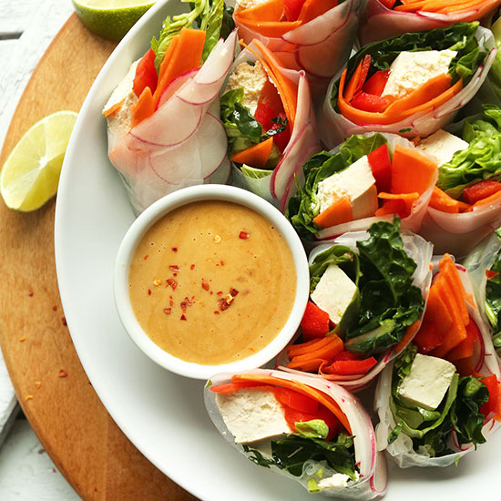 Tray of halved Thai Spring Rolls with Cashew Dipping Sauce