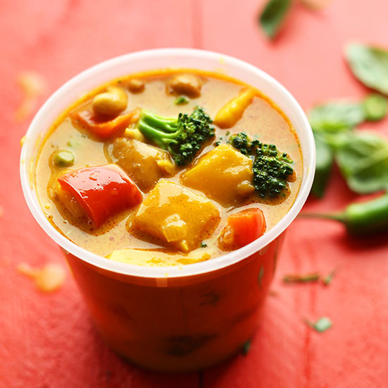 Takeout container filled with homemade Yellow Thai Mango Curry