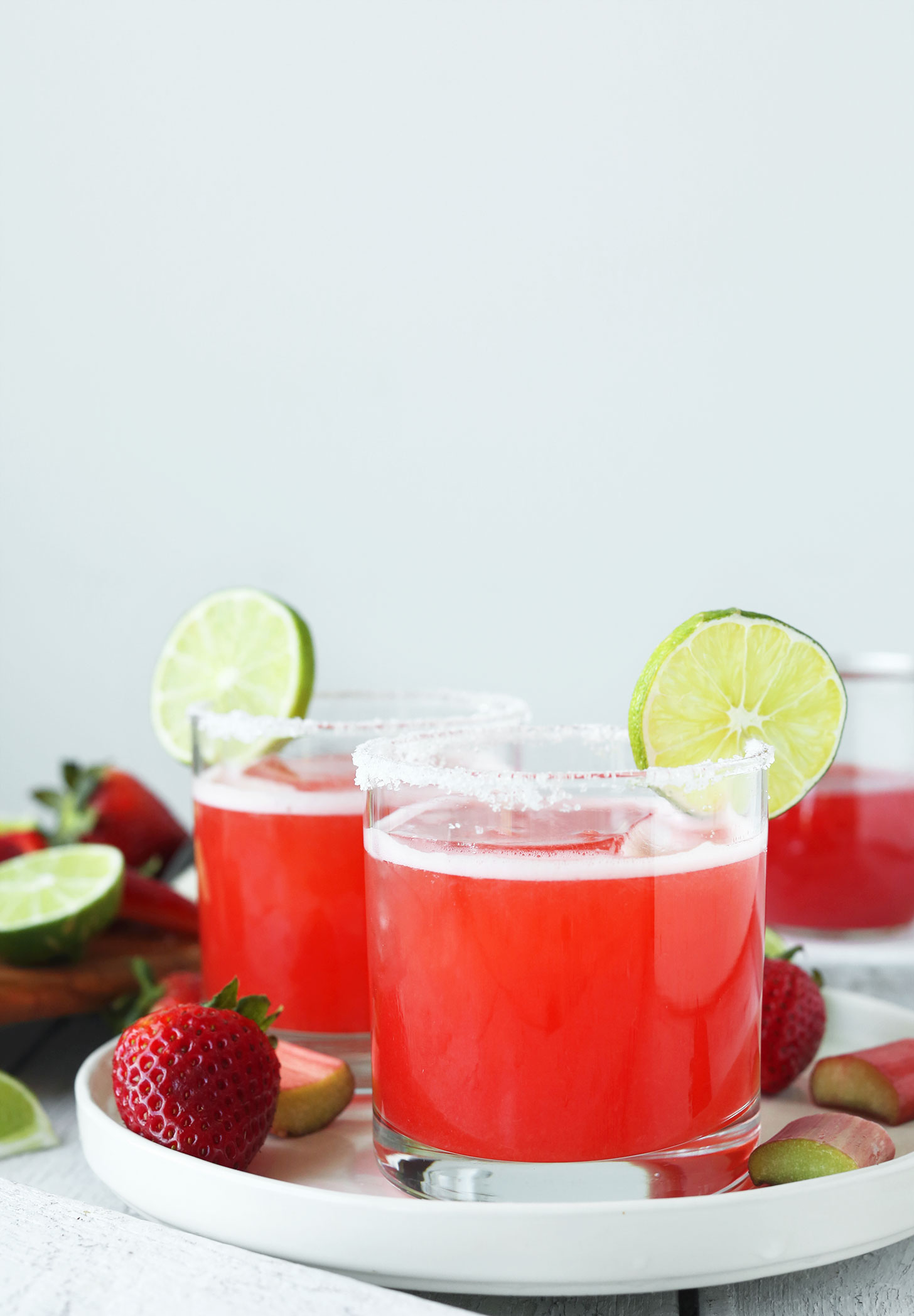 Glasses of our easy Strawberry Rhubarb Margaritas recipe on a try