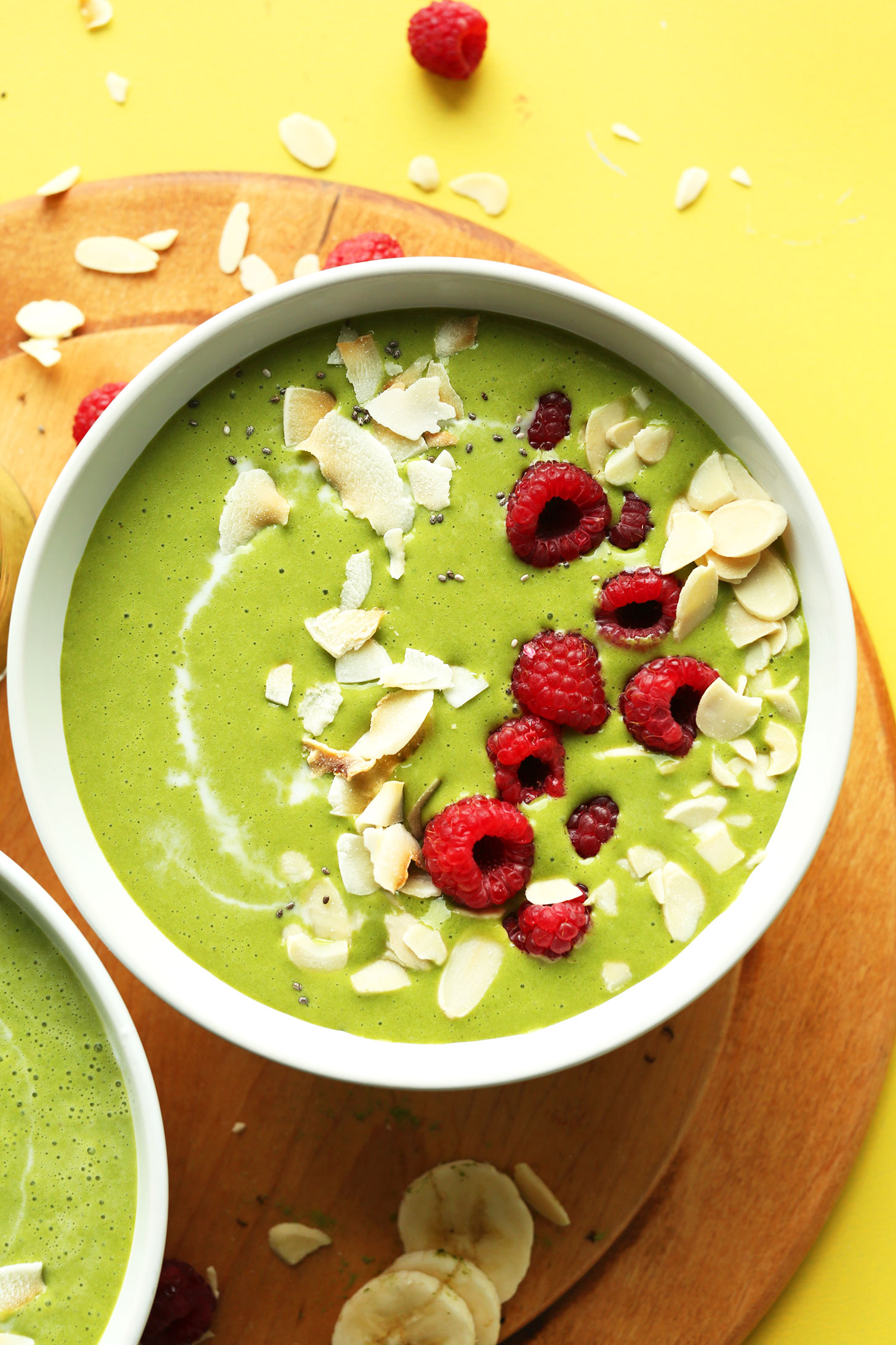 Bowl of our refreshing and creamy Matcha Green Smoothie Bowl made with coconut milk