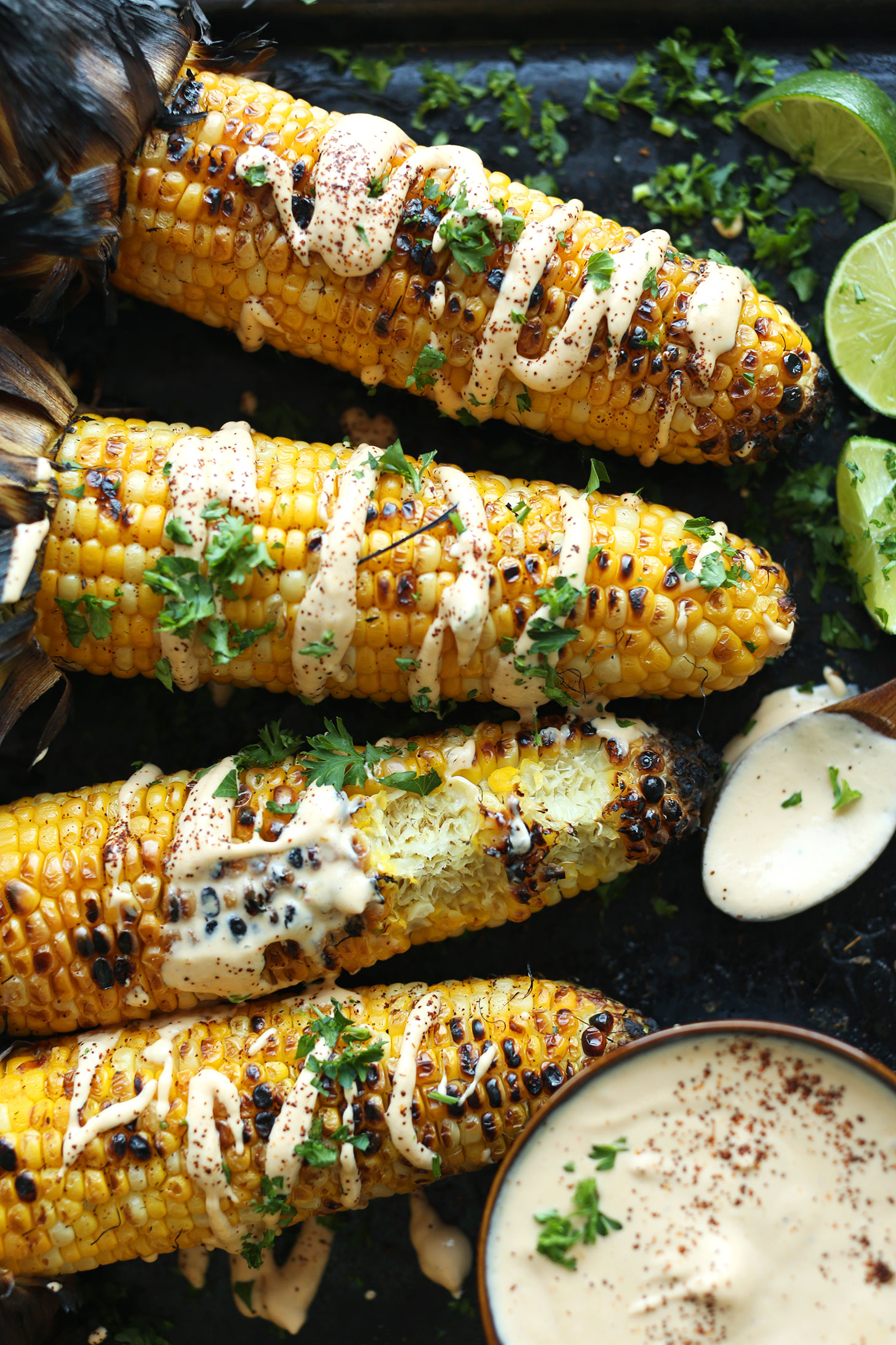 Summer vegetable recipe of Mexican Grilled Corn drizzled with Sriracha Aioli