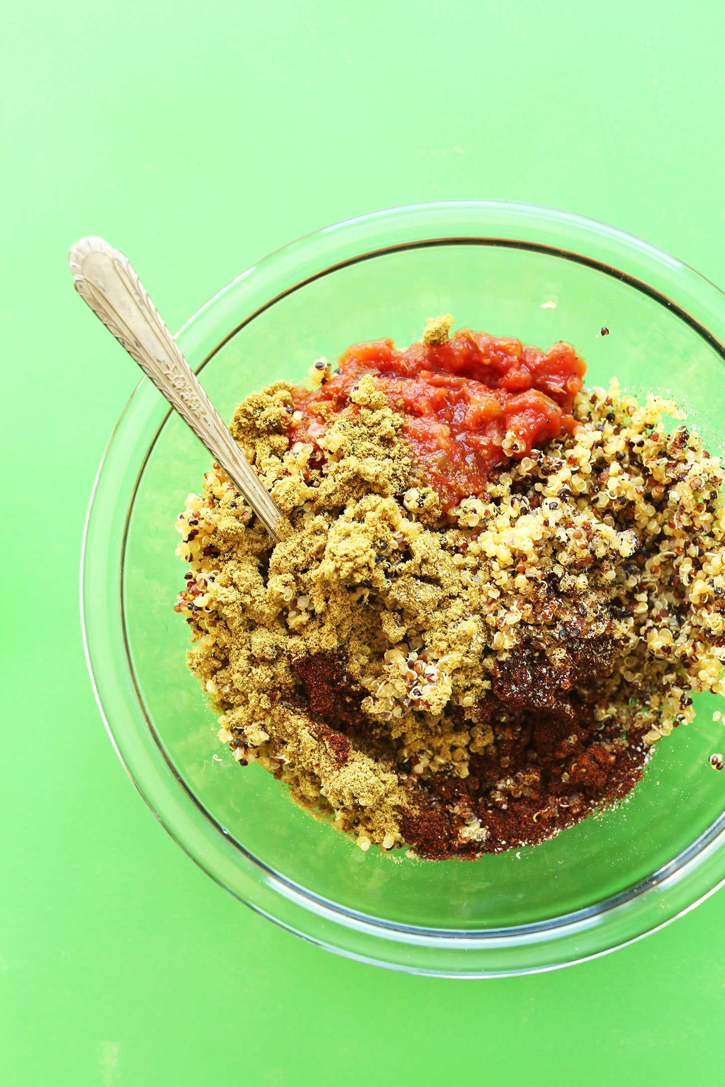 Mixing together quinoa and spices to make healthy, easy Quinoa Taco Meat