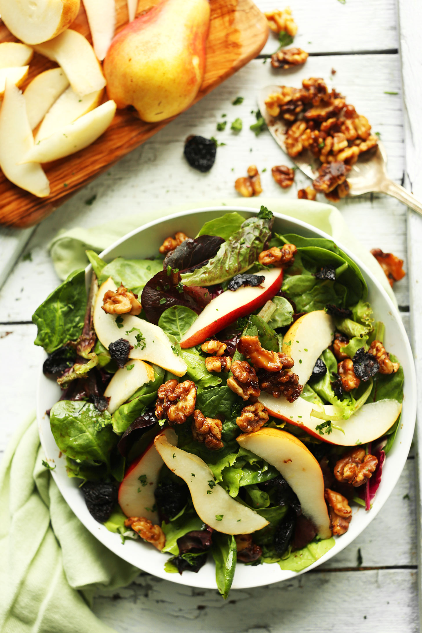 Bowl of our super simple salad made with pears, dried cherries, and candied walnuts