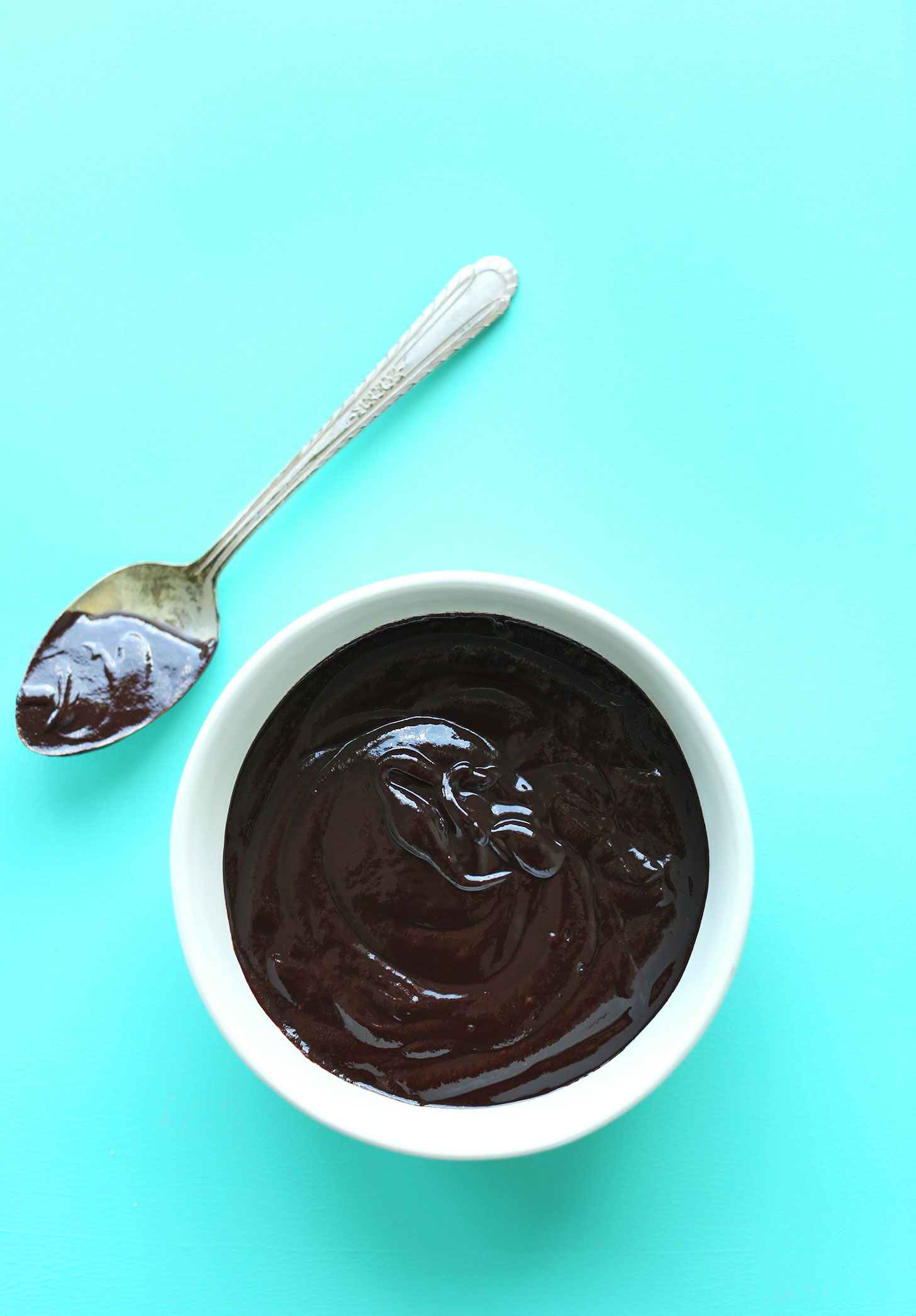 Bowl of chocolate ganache for making gluten-free vegan S'Mores Bars