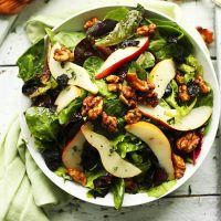Bowl of Pear and Candied Walnut Salad for a healthy fall salad