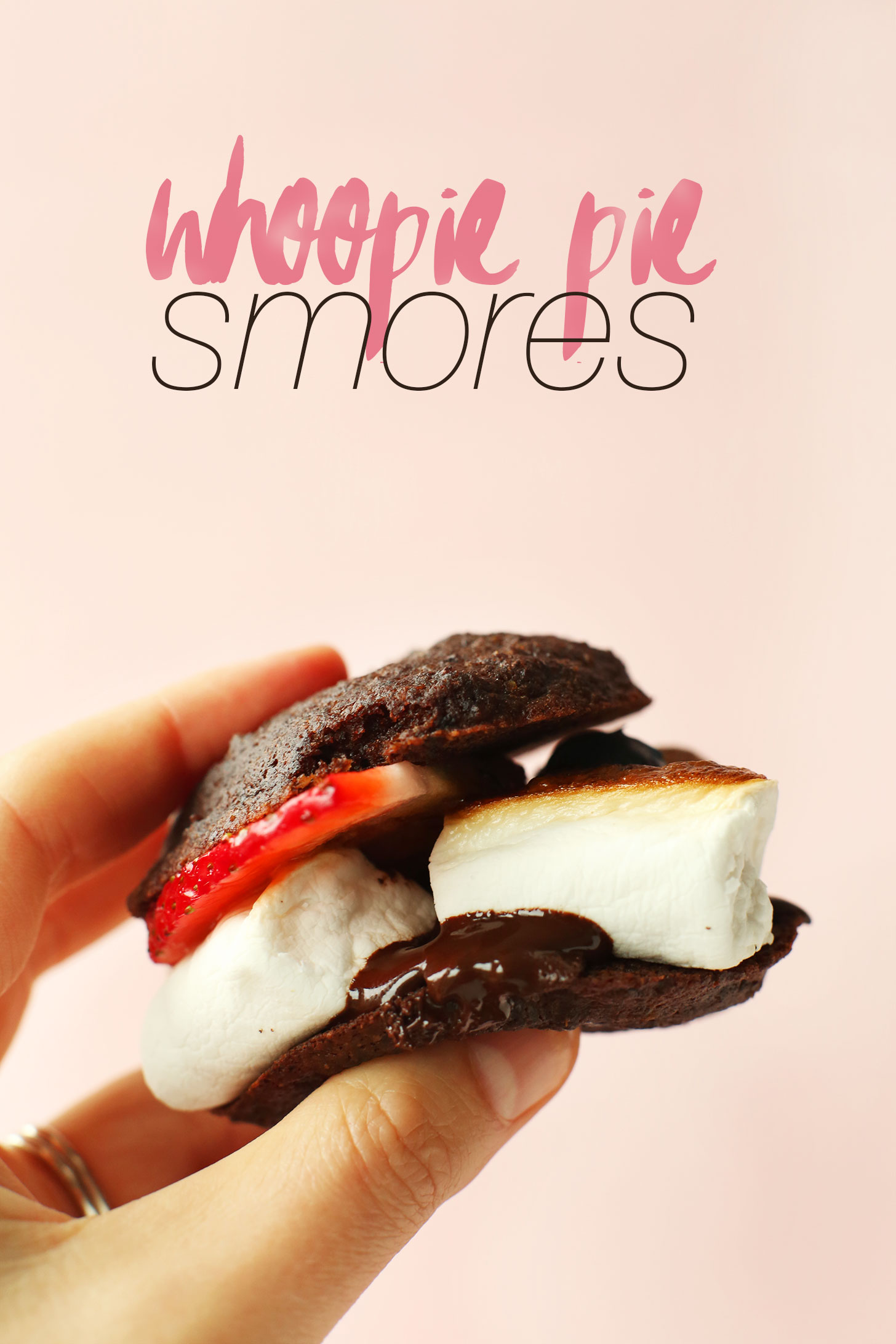 Holding up a gluten-free vegan Whoope Pie S'More for a tasty summer treat
