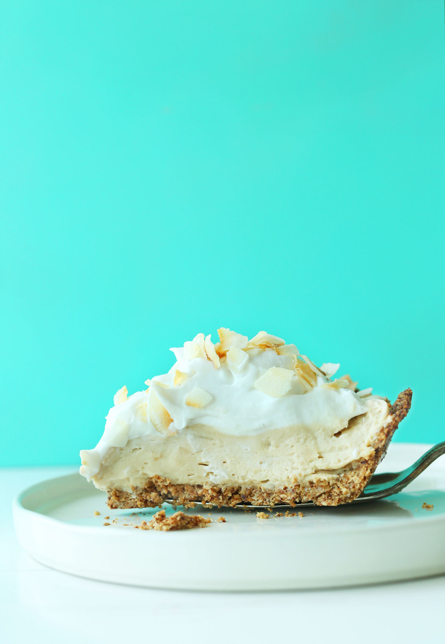 A slice of our Easy gluten-free vegan Coconut Cream Pie recipe