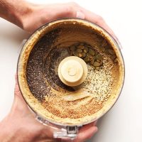 Food processor filled with a batch of our homemade Seedy Sunflower Butter recipe